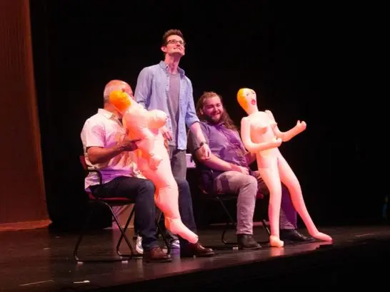 Audience volunteers on stage with inflatable props during An R-Rated Magic Show at V Theater Las Vegas