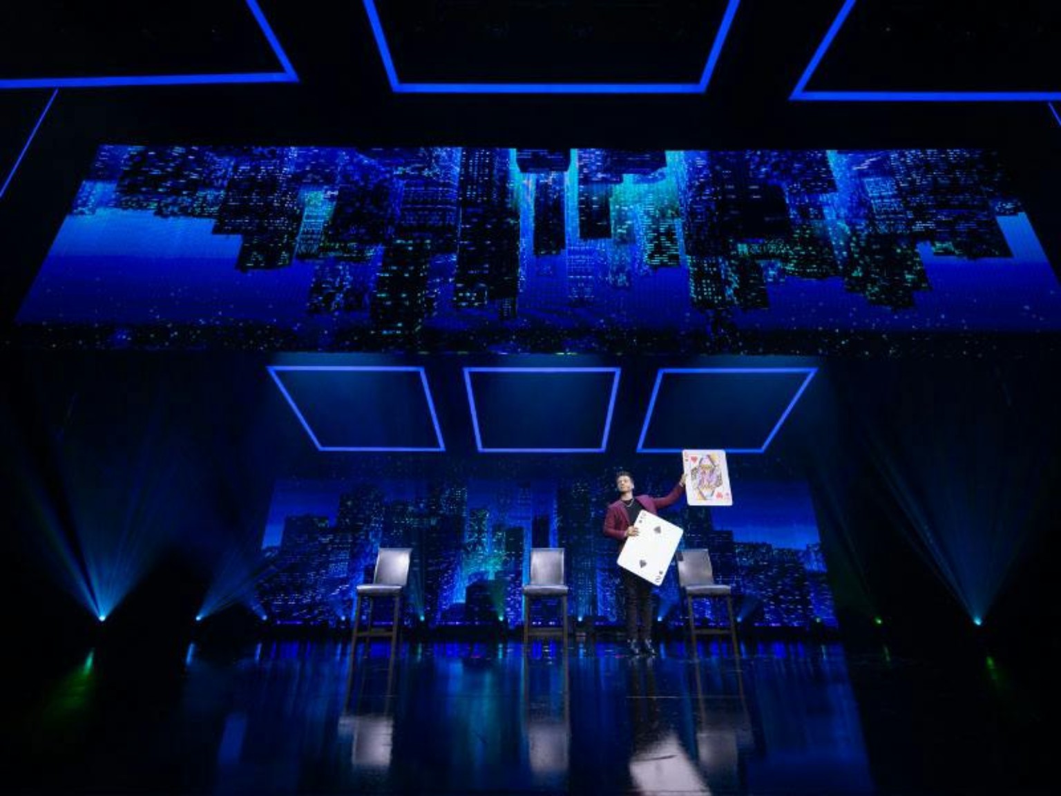 Mat Franco performing an oversized playing card trick at The LINQ in Las Vegas